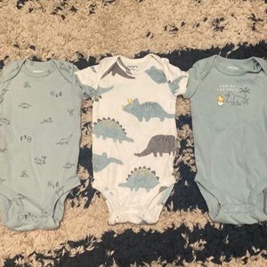 3 blue dinosaur themed onesies